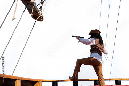 funny the pirate captain traveler discoverer and explorer on the vintage pirate ship on white background