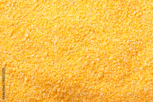 Raw cornmeal flour texture used in polenta on isolated background