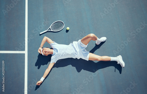 Tired tennis player, sports burnout and game fatigue on court sport training, muscle injury from exercise on ground and sad about mistake. Depressed and Asian athlete upset about competition loss