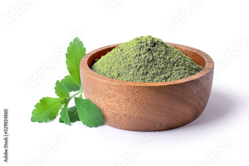 Stevia leaf and stevia powder in wooden bowl isolated on white background.