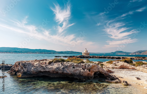 Sunny summer seascape. Saint Theodore lighthouse. Kefalonia island, Argostoli town, Greece, Europe.