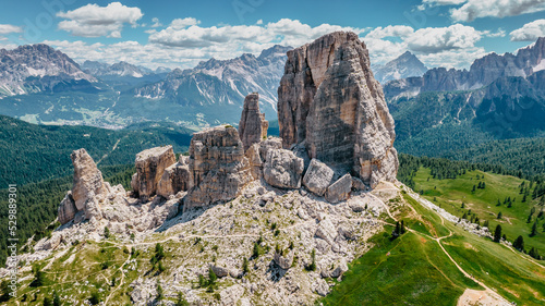 Climbing in Cinque Torri,Dolomites,Italy.Five towers and rock formations close to Cortina d'Ampezzo attract many tourists.Picturesque Dolomite Alps,active summer holiday,steep cliffs.Adventure concept