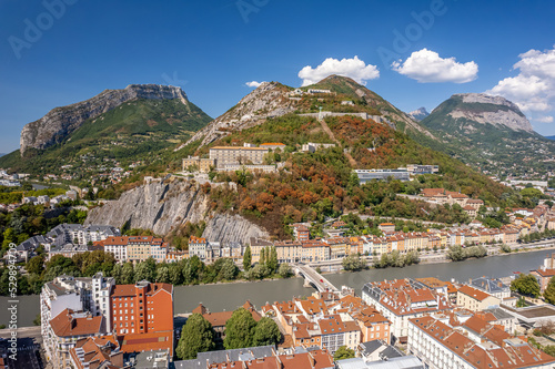 The drone aerial view of hill and fortress of the Bastille. The Bastille located at the south end of the Chartreuse mountain range and overlooking the city of Grenoble, France. 