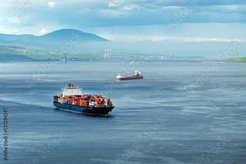 Container ships on St Lawrence river in Quebec, Canada