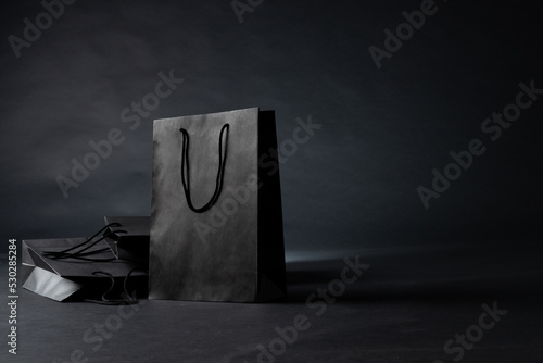 Composition of gray paper shopping bags on gray background