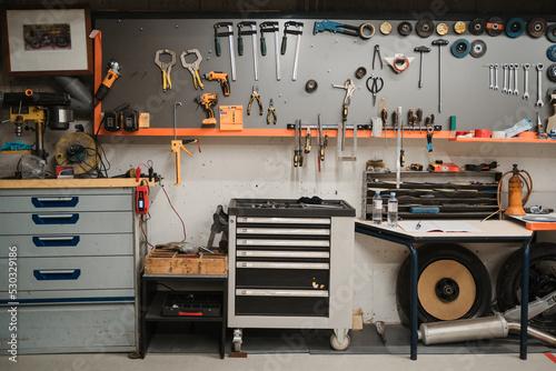 Workshop scene. Tools hanging on the wall in the workshop, garage vintage style