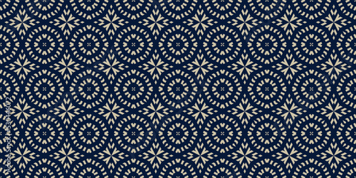 Vector ornamental seamless pattern in traditional arabian, moroccan, turkish style. Golden abstract mosaic background texture with stars, floral shapes. Gold and blue ornament. Premium repeat design