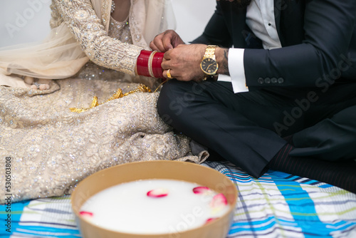 Indian Punjabi after wedding Doli and pani varna ceremony items and hands close up