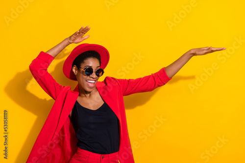 Photo of cool funny short hair person dressed red suit cap dark eyewear dancing isolated yellow color background