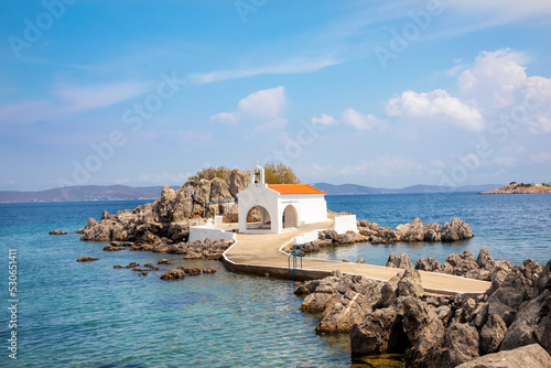 Authentic traditional Greek islands- unspoiled Chios, little church in the sea over the rocks Agios Isidoros. Eastern Aegean islands
