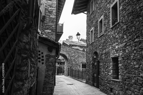 Black and white Photo of a Road without People with Rock Dwellings in Morgex in Aosta Valley, Italy