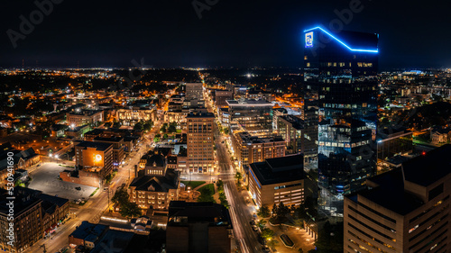 Aerial photograph of the Lexington, Kentucky skyline at night with the city alite.