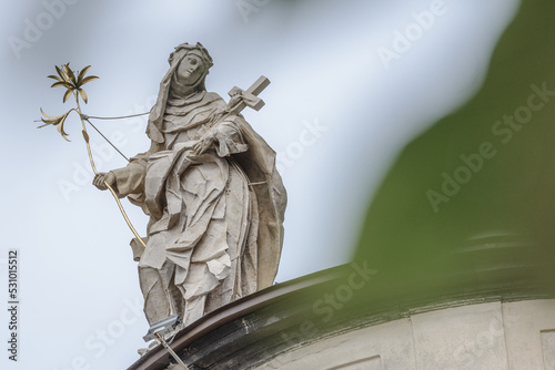 Lviv, UKraine - September 2022: Figure of the Dominican nun Santa Rosa de Lima, located on the eaves of of the Holy Eucharist church (former Dominican church).