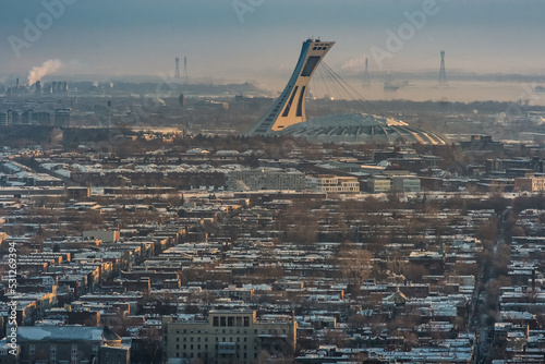 view on the Montreal Olympic stadium at sunrise in winter from Mount Royal (Quebec, Canada)