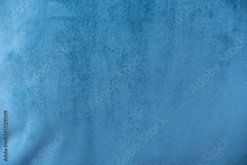 Blue velvet fabric surface from above. velvet texture blue color background. expensive luxury fabric, material, wallpaper.