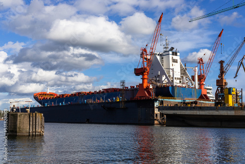 View of the ship being renovated in a dry dock in the Gdansk shipyard