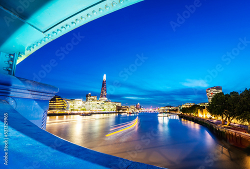 Lights along the River Thames at dusk,viewed from Tower Bridge, City of London,England,United Kingdom.
