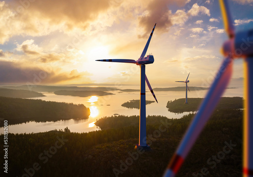 Wind farm wind turbines rise above river. Windmills before sunset. Black wind farm. Landscape sunset with windmills. Getting regenerative electricity. Taking care of power supply. 3d rendering