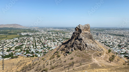 View of the city from a bird's eye view. Beautiful powerful mountains. Sulaiman-Too is a rocky sacred mountain and a symbol of the city of Osh.