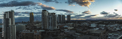 Panoramic skyline and modern buildings. Asphalt road and cityscape at sunrise