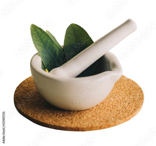 Small porcelain mortar with herbs, isolated.