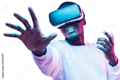 African man in vr glasses, playing video games with virtual reality headset, trying to touch metaverse