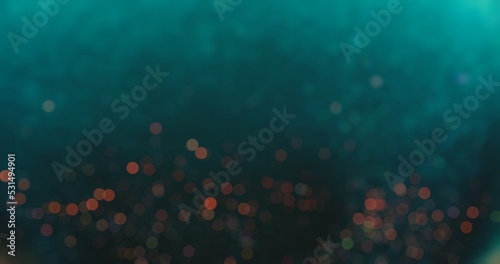 Bokeh light overlay. Blur circles texture. Glowing sparkles. Defocused verdigris green blue red color round particles on dark abstract background.