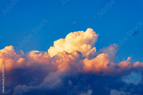 Photography of beautiful storm clouds, cumulus clouds or cumulonimbus at sunset. Full frame, sky only.