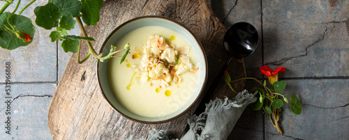 bowl of creamy cauliflower soup on the table