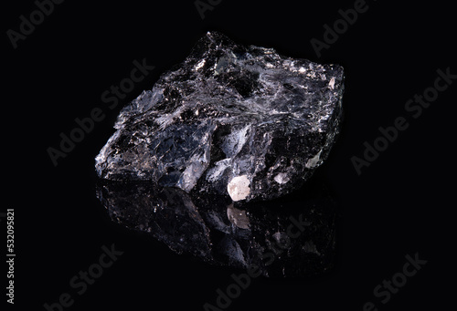 Black mineral galena with a rough surface