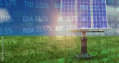Image of financial data processing over solar panels in green field