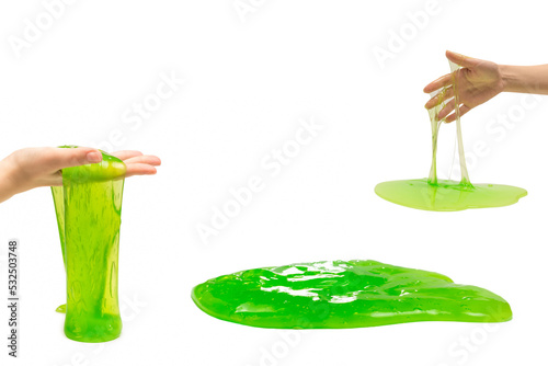 Green slime toy in woman hand isolated on white.