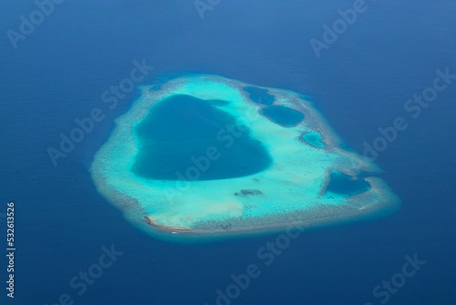 Areal view of small atoll reef in the Maldives 