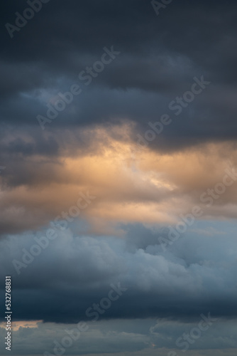 Clouds before a thunderstorm, yellow-blue clouds. Background image, state of mind.