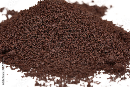 closeup of coffee grounds isolated on white 