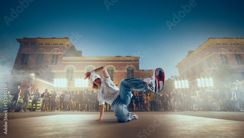 Street dancer girl dance breakdance on evening street