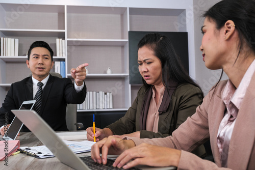 Boss criticise in meeting room.