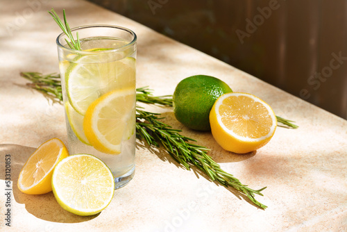 Summer refreshing lemonade and ingredients on light table