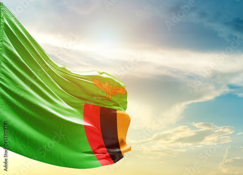 Zambia national flag cloth fabric waving on the sky - Image
