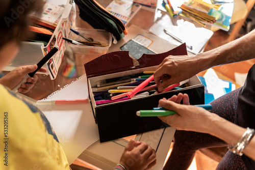 family prepares back to school supplies in home