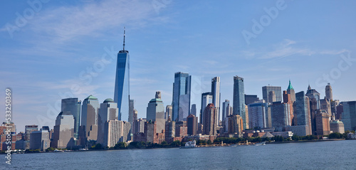 Panorama of New York City skyline from the water on a beautiful sunny day