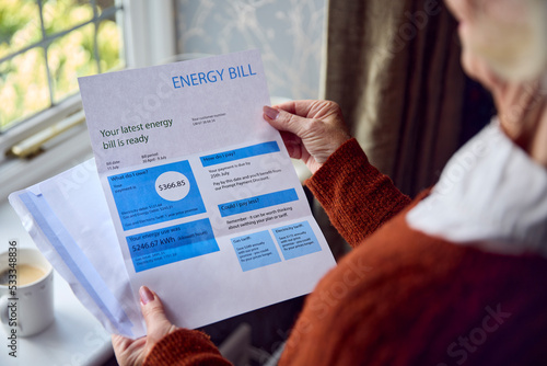 Close Up Of Senior Woman Opening UK Energy Bill Concerned About Cost Of Living Energy Crisis