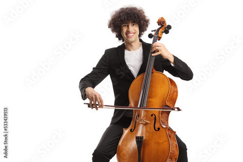 Young man sitting on a chair playing a cello and smiling