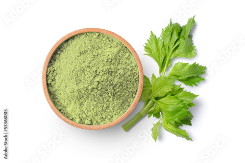 Celery powder in wooden bowl and fresh celery leaf isolated on white background.Top view, flat lay.