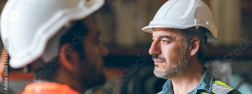professional industrial engineers in hard hats. working at heavy industry manufacturing factory, man worker in an construction industrial job, maintenance service check for safety first concept