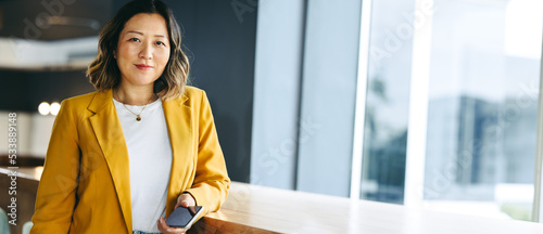 Female entrepreneur looking at the camera in an office