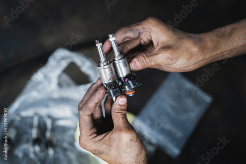 Close-up of automotive fuel injectors.