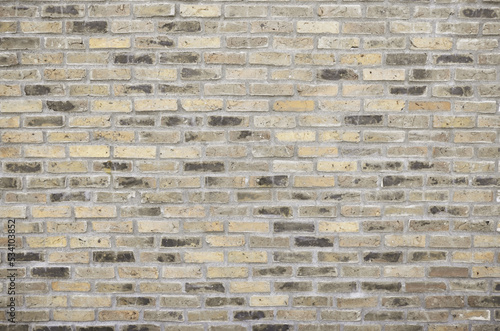 Champagne gold vintage brick wall background. Stylish and grunge brickwork texture for design.