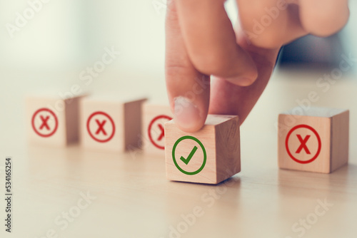 Regulatory compliance, project feasibility concept. Tick and cross signs. Checkmark and cross icons. Do and don't or like and unlike with positive and negative sign, approve and disapprove symbols.