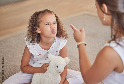 Angry, adhd and child being rude to her mother showing anger, bad behaviour and attitude problems at home. Mean, moody and girl with tongue out making parenting difficult for an annoyed and upset mom